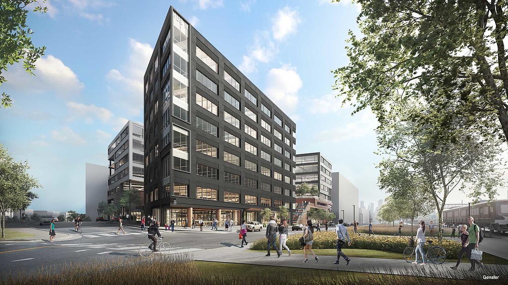 A group of people walking around a large building.